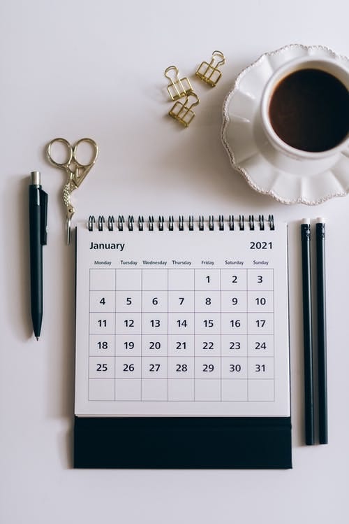 Calendar with a cup of coffee