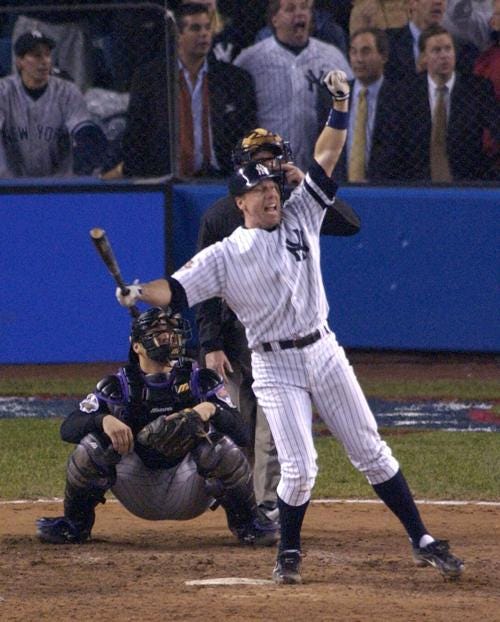 Scott Broscius of the New York Yankees celebrates after hitting a game-tying 9th inning homer in game five of the 2001 World Series.