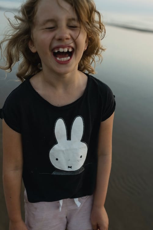 A girl laughing.
