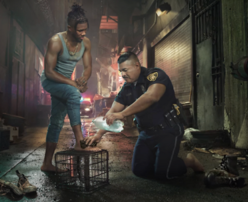 This is a photo illustration of a white police officer washing the feet of a street person of colour, as discussed by John G. Stackhouse, Jr.