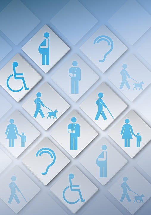 A vector graphic that shows a tile of many disabilities symbols. A person in a wheelchair, a blind person using a cane etc.