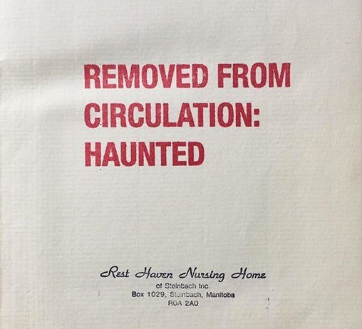 front page from random book with a big rubber stamp across it saying REMOVED FROM CIRCULATION: HAUNTED