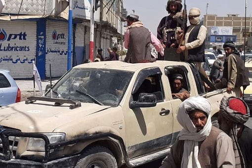Taliban soldiers in Toyota Truck (most famous car company for Terrorists)