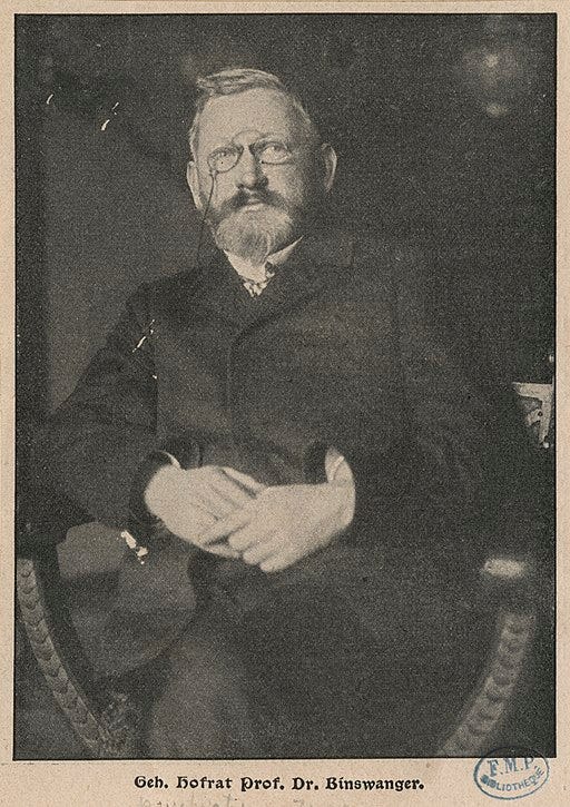 Black and white photograph of Otto Binswanger, German Psychiatrist. He is wearing glasses and folding his arms.