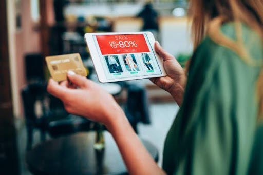 A woman doing online shopping from an app