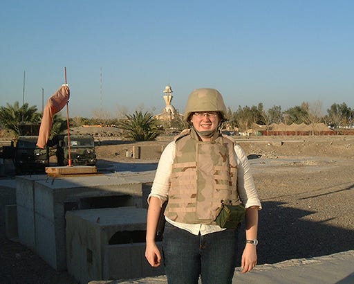 Karen Sudkamp waiting for a helicopter in Baghdad, Iraq, 2005. Photo courtesy of Karen Sudkamp