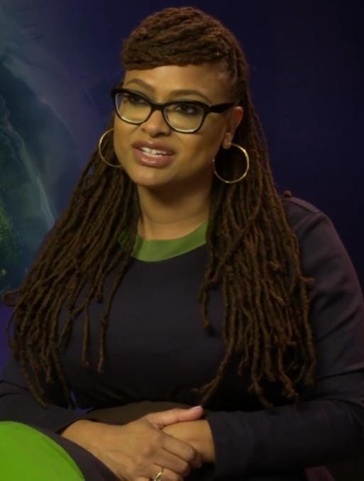 A picture of Ava DuVernay with her black glasses on.