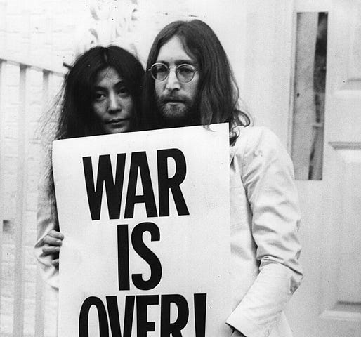 Yoko Ono and John Lennon on the steps of the Apple building in London during a peace campaign protesting against the Vietnam War, December 1969.