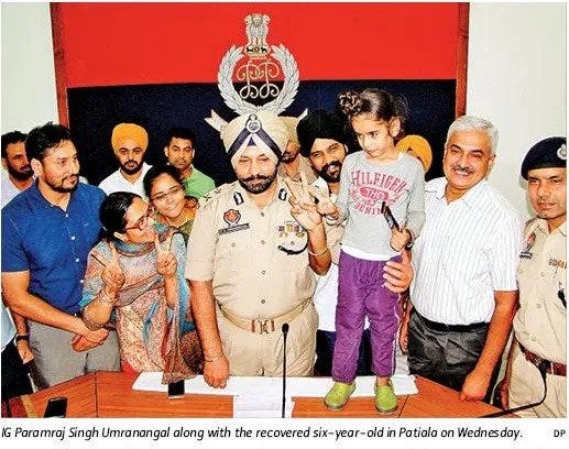 IG PS Umranangal along with the recovered six-year-old Hartej Bir Singh in Patiala.