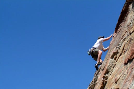 A Man Climbing a Rock Wall - Photo courtesy of ©iStockphoto.com/LUGO, Image #1827245