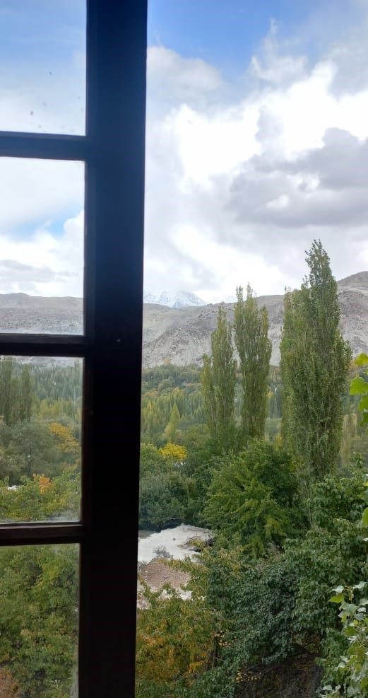 A window opening to autumn trees and brown mountains of the Skardu City in Pakistan. Daily Journal, Diary