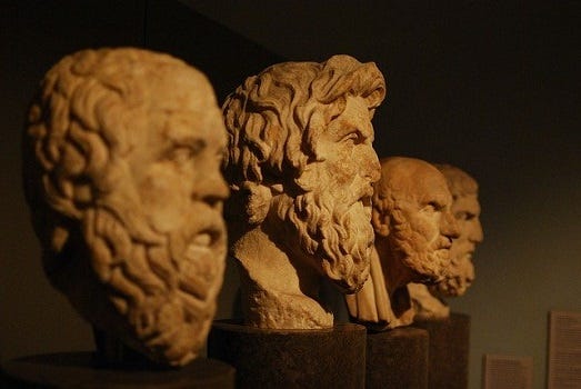 Image showing ancient Greek busts, with Aristotle in the center.