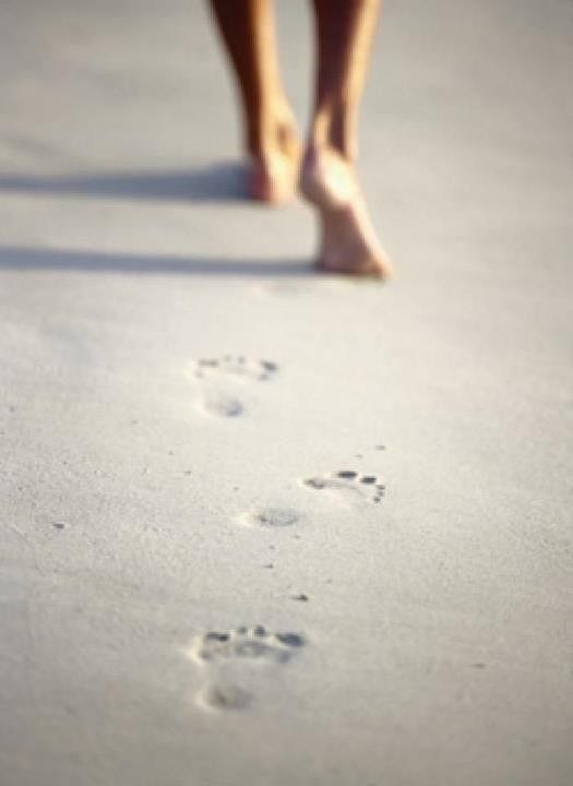 footprints in the beach sand