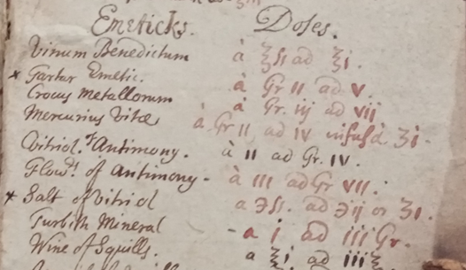 Detail from a page of handwritten recipes. The eighteenth-century handwriting is coloured in red and brown and provides a list of emetics on the left with a list of doses on the right