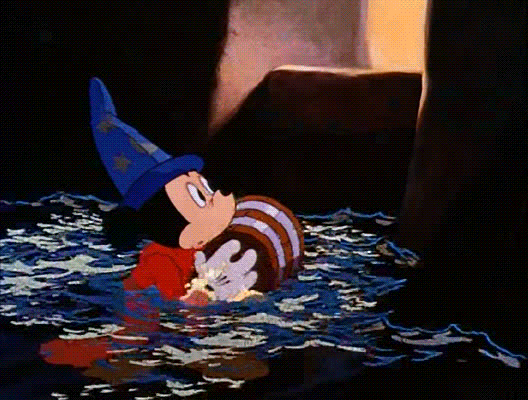 Animated GIF of Mickey Mouse struggling to move through the dark, deep water of the flooded workshop.