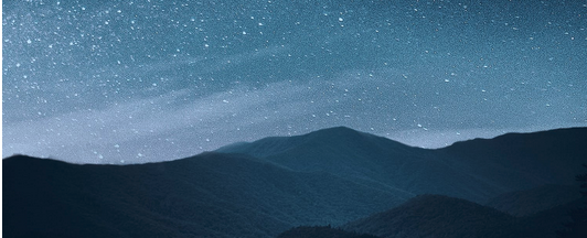 Stars over a hilly skyline