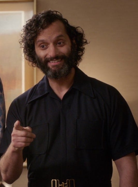 A still from the NBC sitcom ”The Good Place”, showing Jason Mantzoukas as the character ‘Derek’, a malfunctioning AI that’s prone to inserting his own name into his sentences. Maximum Derek!