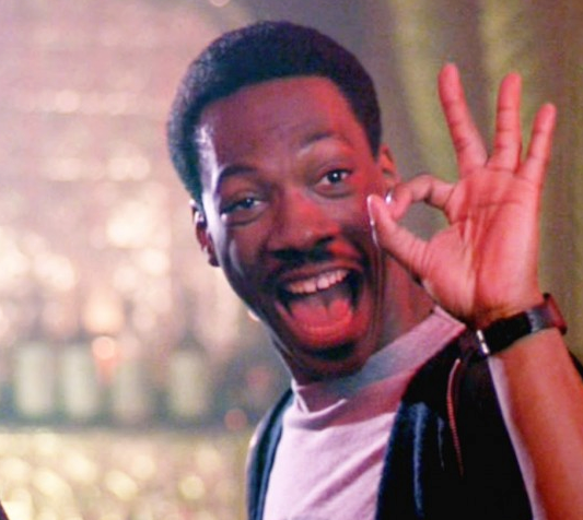 Eddie Murphy giving the OK symbol — From Beverly Hills Cop