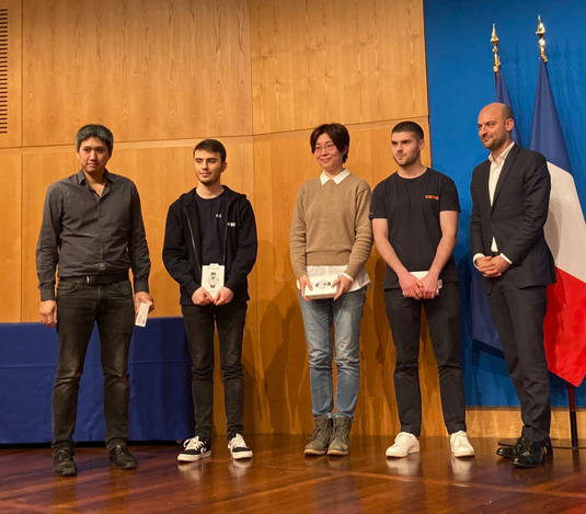 from left to right : Julien Ta (Software Engineer), Quentin Le Helloco (Software Engineer), Tianshu Yang (ML Engineer), Pierre Guillaume (Software Engineer) and Jean-Noël Barrot (Minister for Digital Transition and Telecommunications)