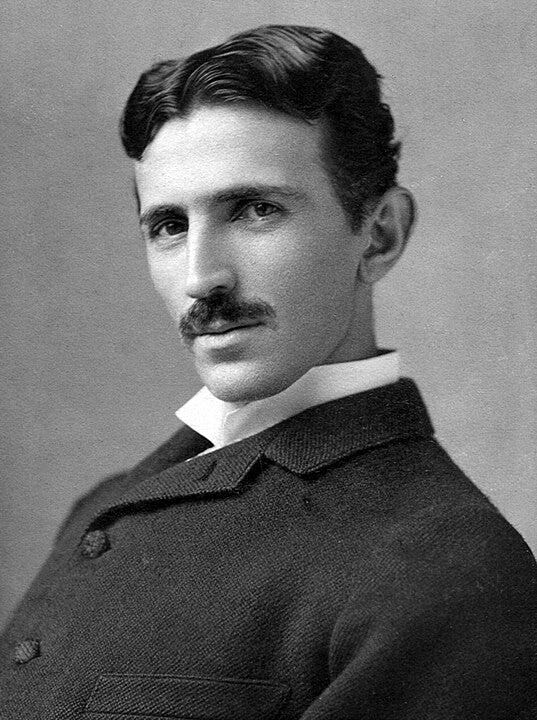 A photograph image of Nikola Tesla (1856–1943) at age 34.