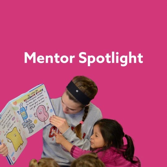 Mentor Amanda reading a children’s book to one of her mentees.
