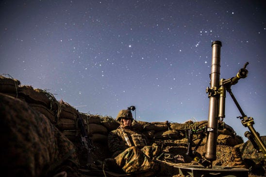 Lance Cpl. Griffin Forrester stands his post in his fighting hole during a beach raid aboard Camp Pendleton, California, March 6, 2015. After securing the beach, Marines tactically moved to Camp Horno, where the Marines dug fighting holes and trained in defensive tactics during Amphibious Squadron/Marine Expeditionary Unit Integration Training.