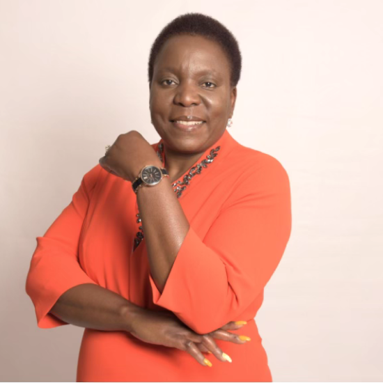 Portrait of Beka Ntsanwisi in an orange shirt.