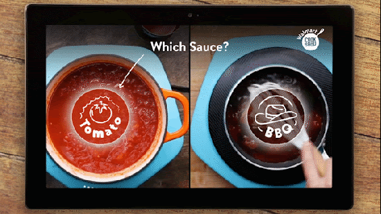 A user chooses to make tomato sauce instead of a BBQ style inside an interactive video cooking experience.