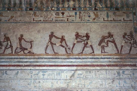 Closeup of a mural depicting wrestling positions, located in the 15th tomb in Beni Hasan, 2000 BC.