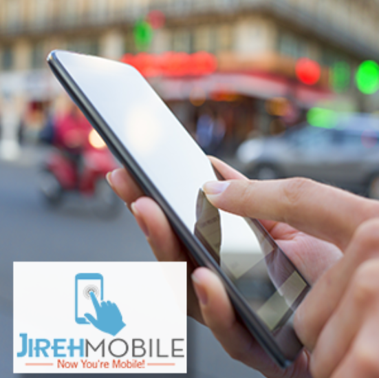 A person’s hand is holding a mobile phone with a blurred cityscape in the background. A logo for Jireh Mobile is in the bottom left of the image with a blue hand touching a blue mobile phone. Below is the “JIREHMOBILE” with “JIREH” in blue, and “MOBILE” in gray. At the very bottom are the words “Now You’re Mobile” in orange.