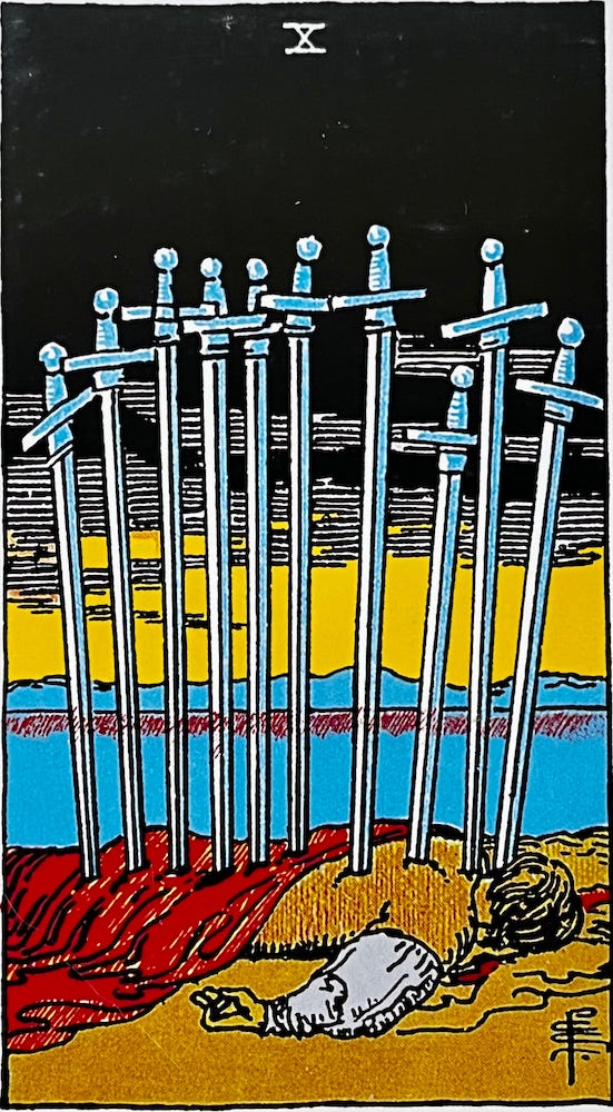 The Ten of Swords — A man lies face down in a pool of blood with ten swords stuck into his back. The sky is ominous and there is a hint of light in the sky indicating sunrise.