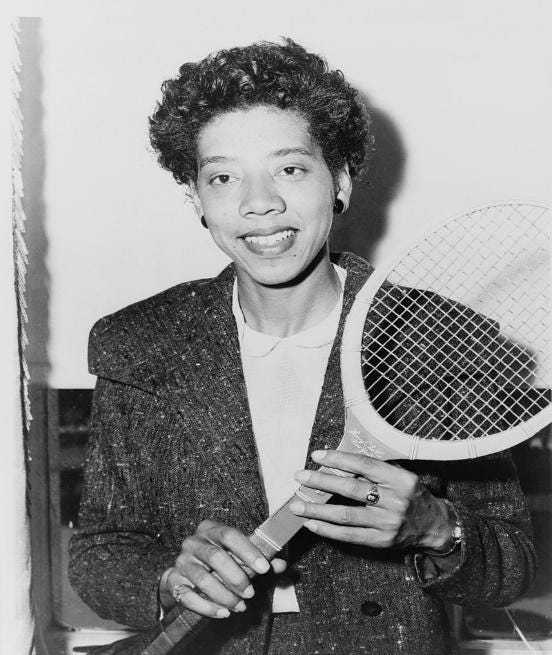 Althea Neale Gibson holding a tennis rocket.