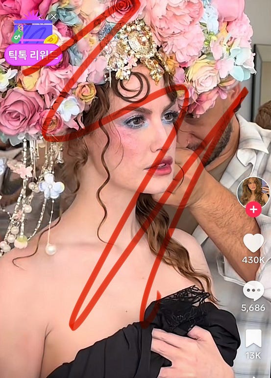 Author screenshot of a Hailey Bailey TikTok where she is being dressed for the MET gala. Red scribbles cross the screenshot.