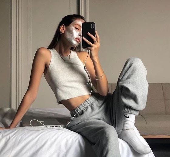 Girl takes a mirror photo in comfy clothing