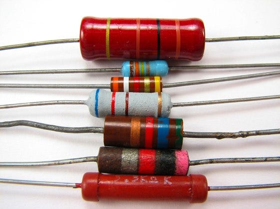 Resistors in a stack. Our blog answers the question “do resistors have polarity?”