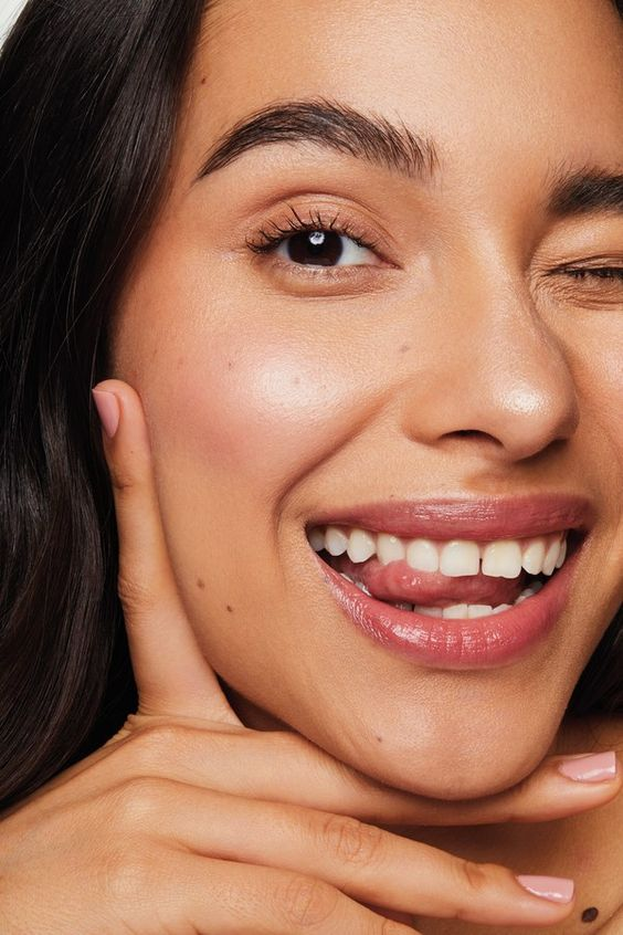 A Girl smiling with glowing skin