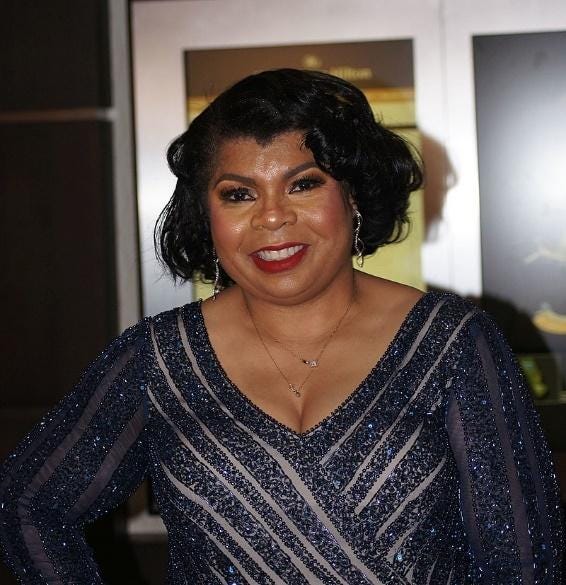 Photo of April Ryan in her stunning attire.