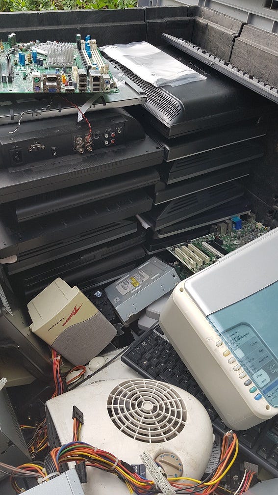 Wires, computers and other electrical equipment in a bin