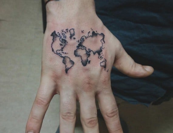 world map tattoo on hand