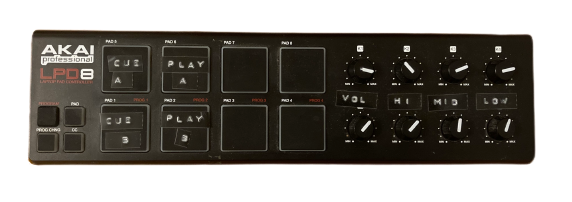 A MIDI controller: A black plastic rectangle which has eight rectangular drum pads on the left and eight round knobs on the right, each arranged in two rows of four.