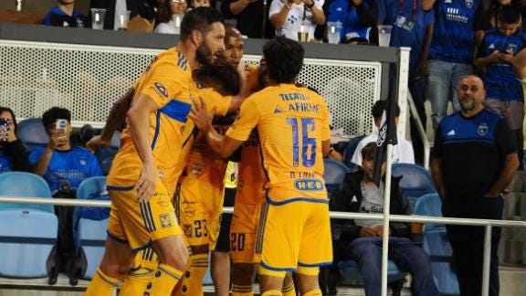 Tigres players celebrate their decisive goal of the match