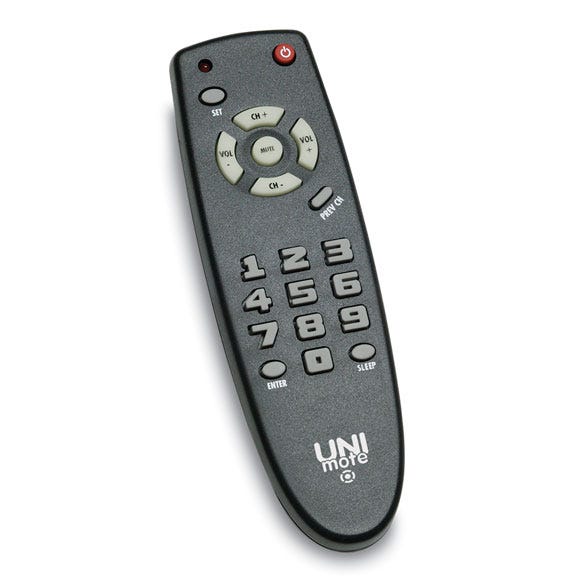 Image of a TV remote controller, with elevated numbers and different shapes for buttons, placed on a white surface