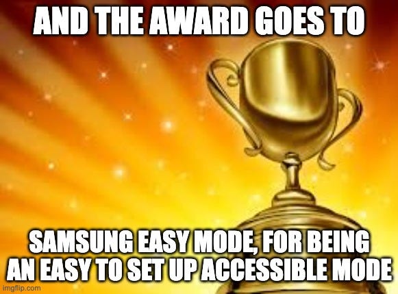 a picture of a trophy, and a glowing, sparkling sunburst. Text reads: “And the award goes to Samsung easy mode, for being an easy to set up accessible mode”