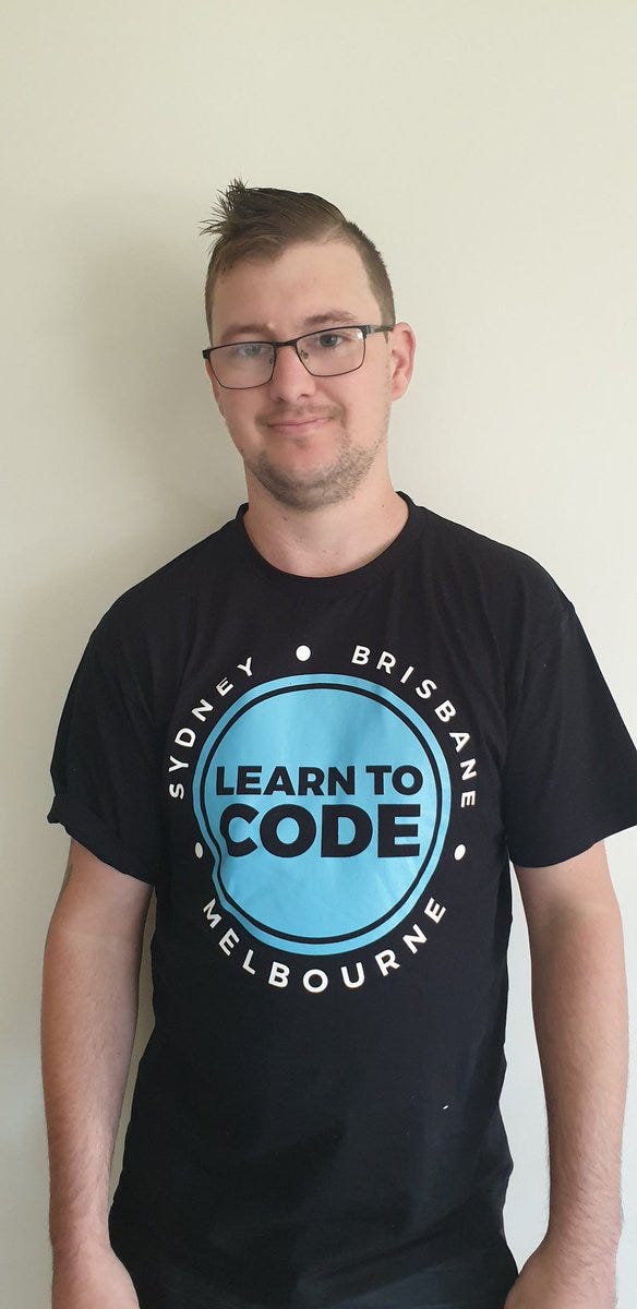 A photo of myself wearing my new shirt from Coder Academy. It reads Learn To Code