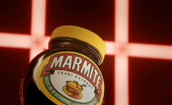 A GIF of the lid flying off a Marmite jar
