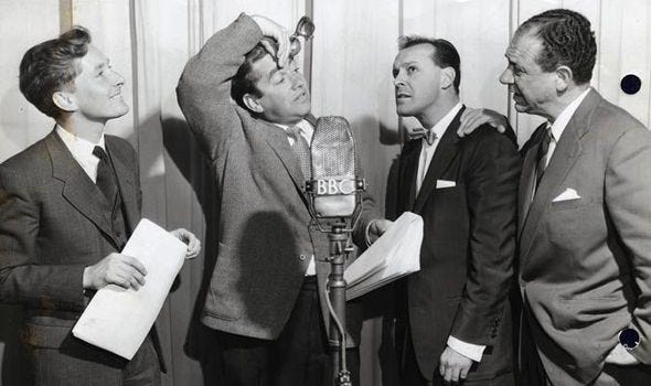 Kenneth Williams, Tony Hancock, Bill Kerr and Sid James, stood around a BBC microphone.