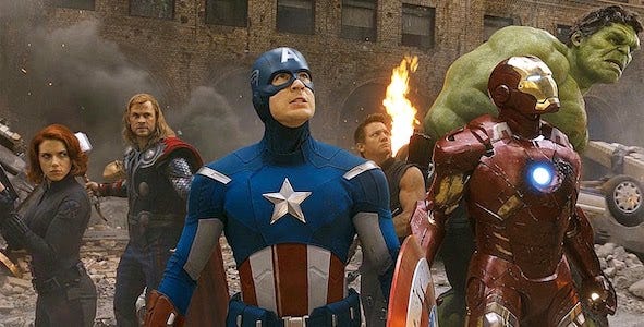 A still frame from the first “Avengers” movie of the heroes circled around, ready for battle
