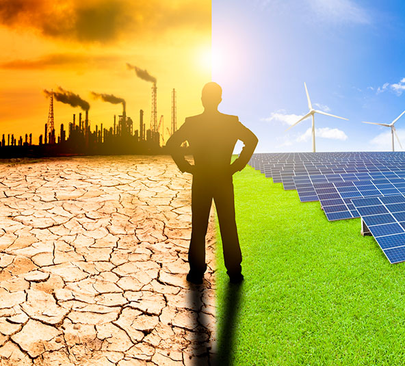 Silhouette of a man standing confidently on a dividing line between a dry, cracked landscape under a polluted sky with industrial factories and a lush green side with wind turbines and solar panels under a clear sky.