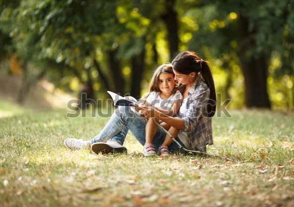 Mom, 4 year old daughter, book, storytelling, sitting on ground