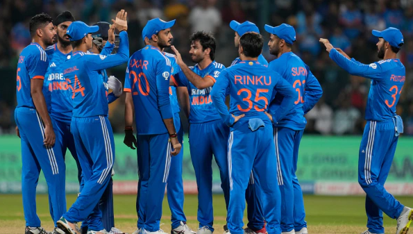 Indian players celebrate the dismissal of Australia’s Travis Head during the fifth T20 cricket match between India and Australia in Bengaluru, India, Sunday, Dec. 3, 2023.